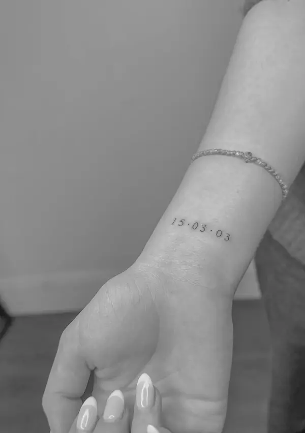 Date tattoo 15.03.03 on wrist with fine line work by Chelsea.Q